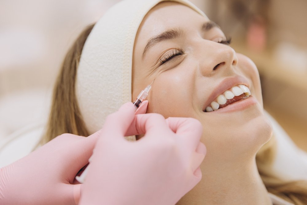 Professional,Beautician,Performing,Botox,Injection,,Treating,Wrinkles,On,Smiling,Female Understanding the Benefits of Botox Treatments